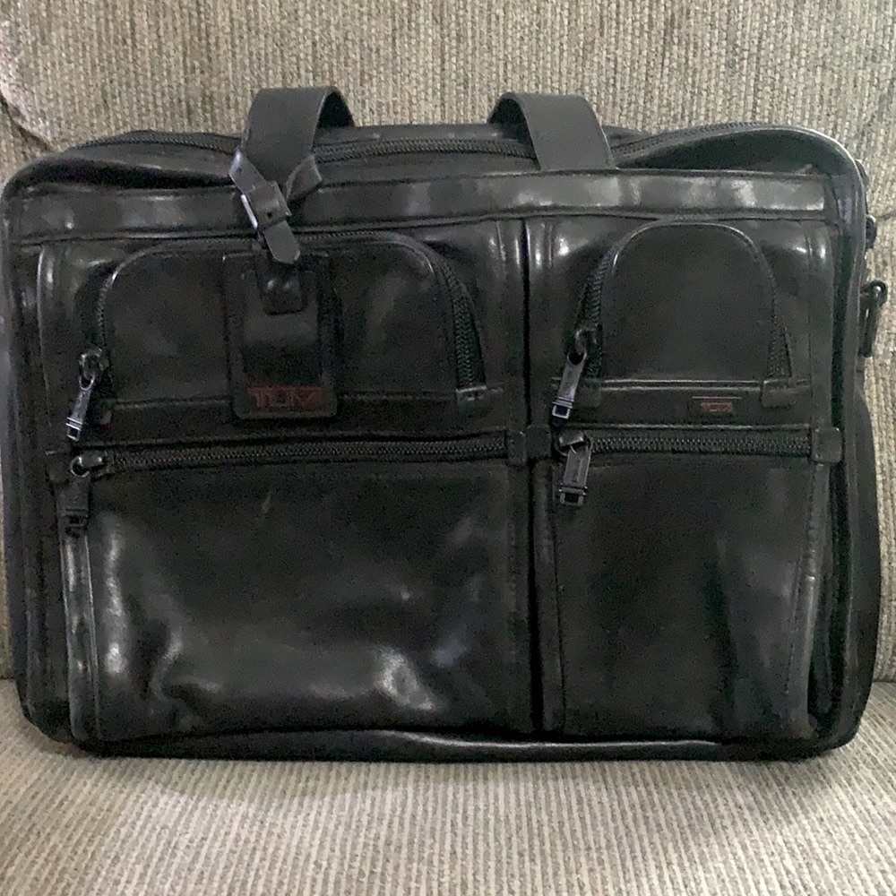 Black TUMI brief bag, Like new. No shoulder strap, no rips, no cuts, no scrapes